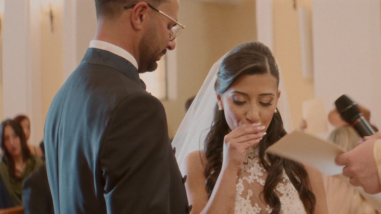 Bride and groom exchanging vows during the church ceremony in Calabria